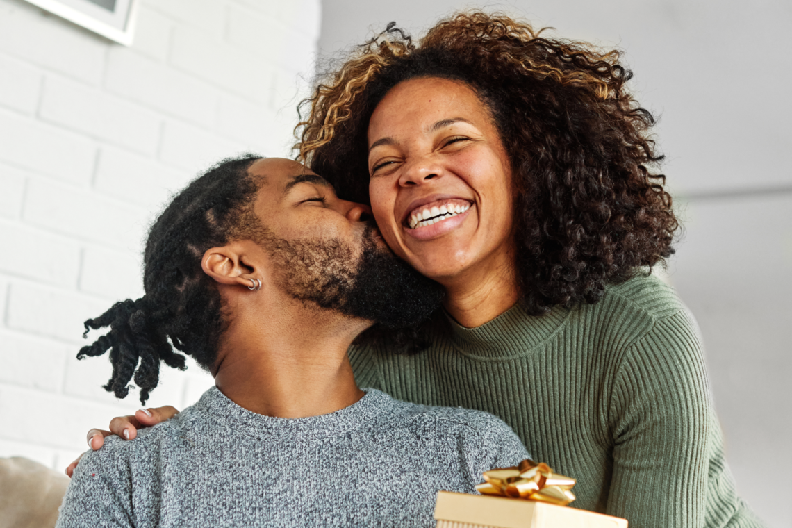 Smiling African American couple celebrating a happy moment